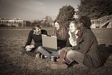 College Students with Computer at Park