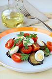 salad with eggplant, tomato and quail eggs