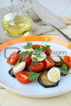 salad with eggplant, tomato and quail eggs