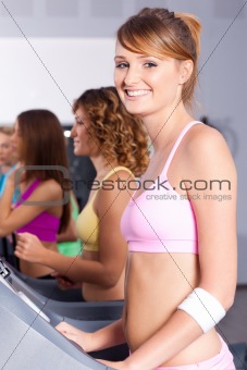 Group of women running on treadmill