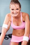 Young woman smiling doing cardio exercise
