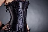 Close-up of woman in black corset 