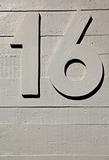 number sixteen concrete wall