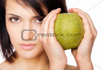 Female holding granny smith apple