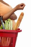 Pregnant woman with shopping basket