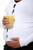 Pregnant woman holding a glass of orange juice