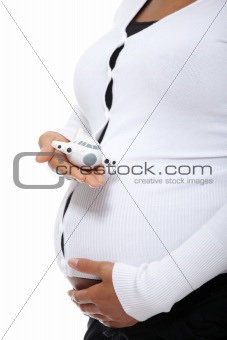 Pregnant woman holding small plane