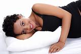 Beautiful pregnant woman lying on bed