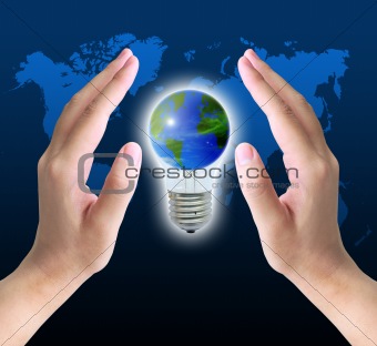 the world in light bulb on women hand