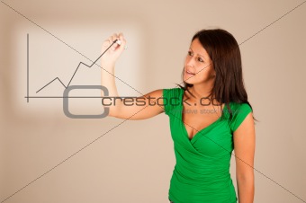 Closeup of young business woman drawing graph on transparent gla