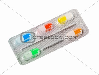 One metallic blister with colorful pills