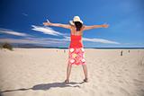 happy woman with straw hat at beach