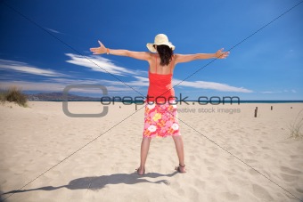 happy woman with straw hat at beach