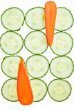 Carrot and cucumber slices arrranged in a pattern.