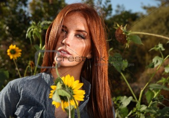 Red Haired Woman Outdoors in a Sunflower Field