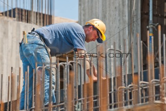 Construction worker busy with forwork frames