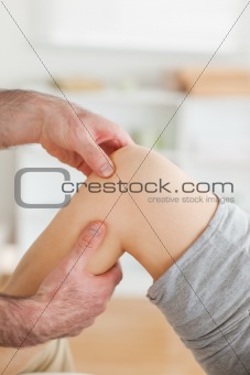 Guy massaging a knee