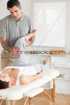 Chiropractor and patient doing exercises