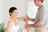 Chiropractor working on a woman's arm