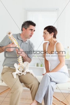 Woman listening to her chiropractor