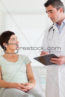 Male Doctor and female patient looking at each other