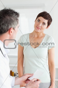 Close up of a smiling Woman receiving a prescription