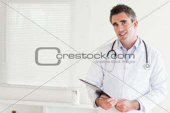 Smiling male Doctor looking into the camera