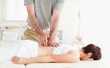 Brunette woman getting a back-massage