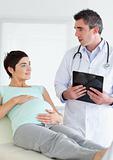 Doctor talking to a pregnant woman