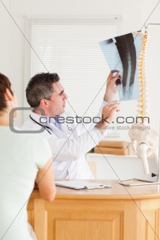 Doctor showing a patient a x-ray