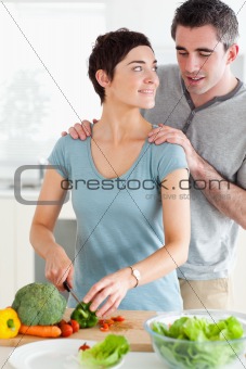 Husband peeking over his wife's shoulder
