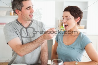 Man feeding his wife
