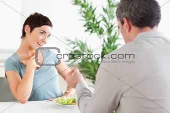 Man proposing to smiling girlfriend