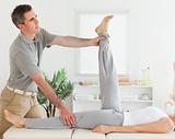 Chiropractor exercising with a customer