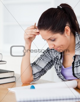 Young student focusing on homework