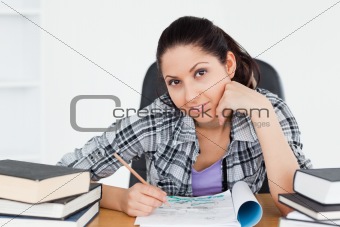 Cute young student doing homework