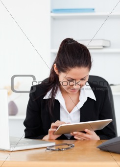 Young businesswoman with touchpad