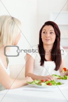 Portrait of amazed Women eating salad
