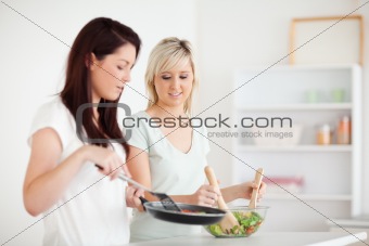 Beautiful Women cooking dinner