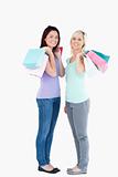 Smiling women with shopping bags