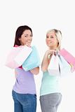 Young women with shopping bags