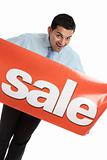 Happy businesman or saleman with sale sign