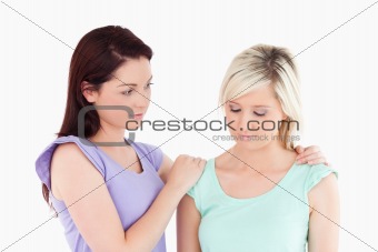 Young women comforting her friend