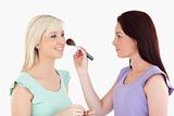 Women applying make-up