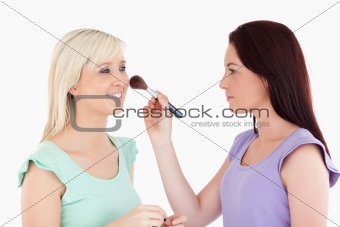 Women applying make-up
