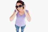 Smiling Woman with headphones and sunglasses