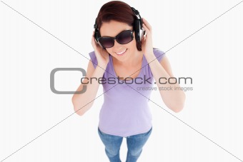 Cute Woman with headphones and sunglasses