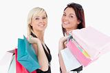 Cute well-dressed women with shopping bags