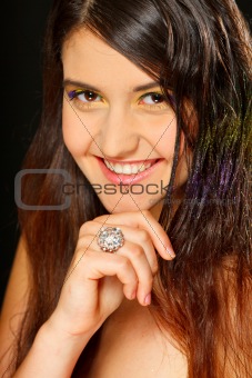 Portrait of beautiful smiling girl with ring on hand
