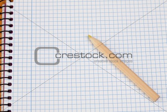 Sharp pencil on a spiral notebook